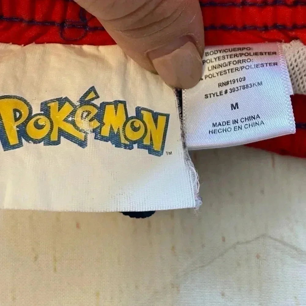 Boys Pokémon branded swim trunks.‎ Size M